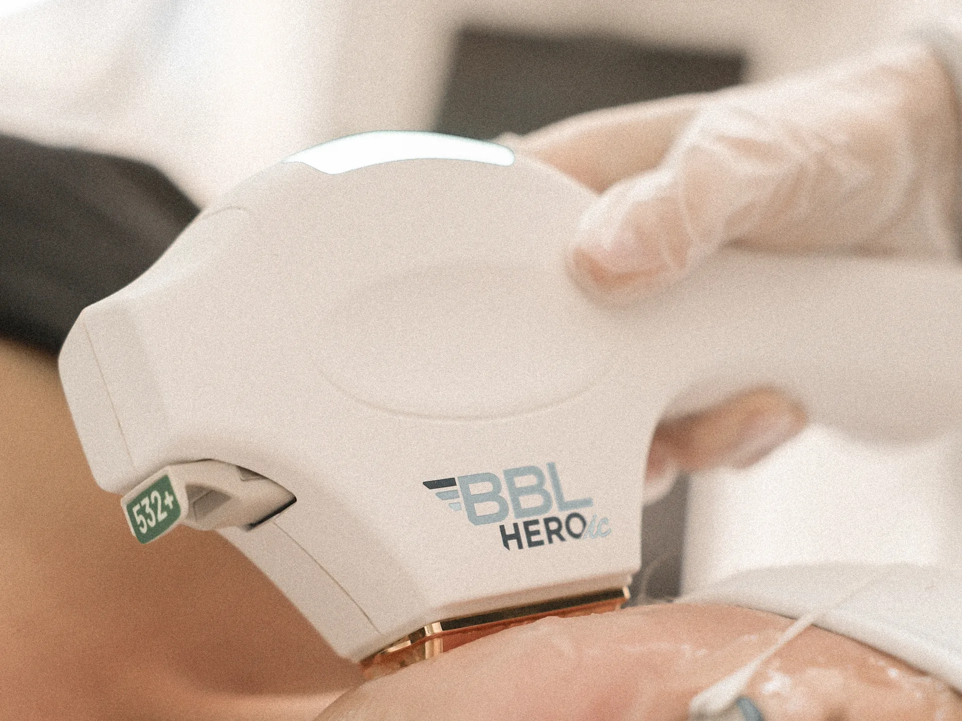 A clinician treating a patient with the BBL HEROic handpiece