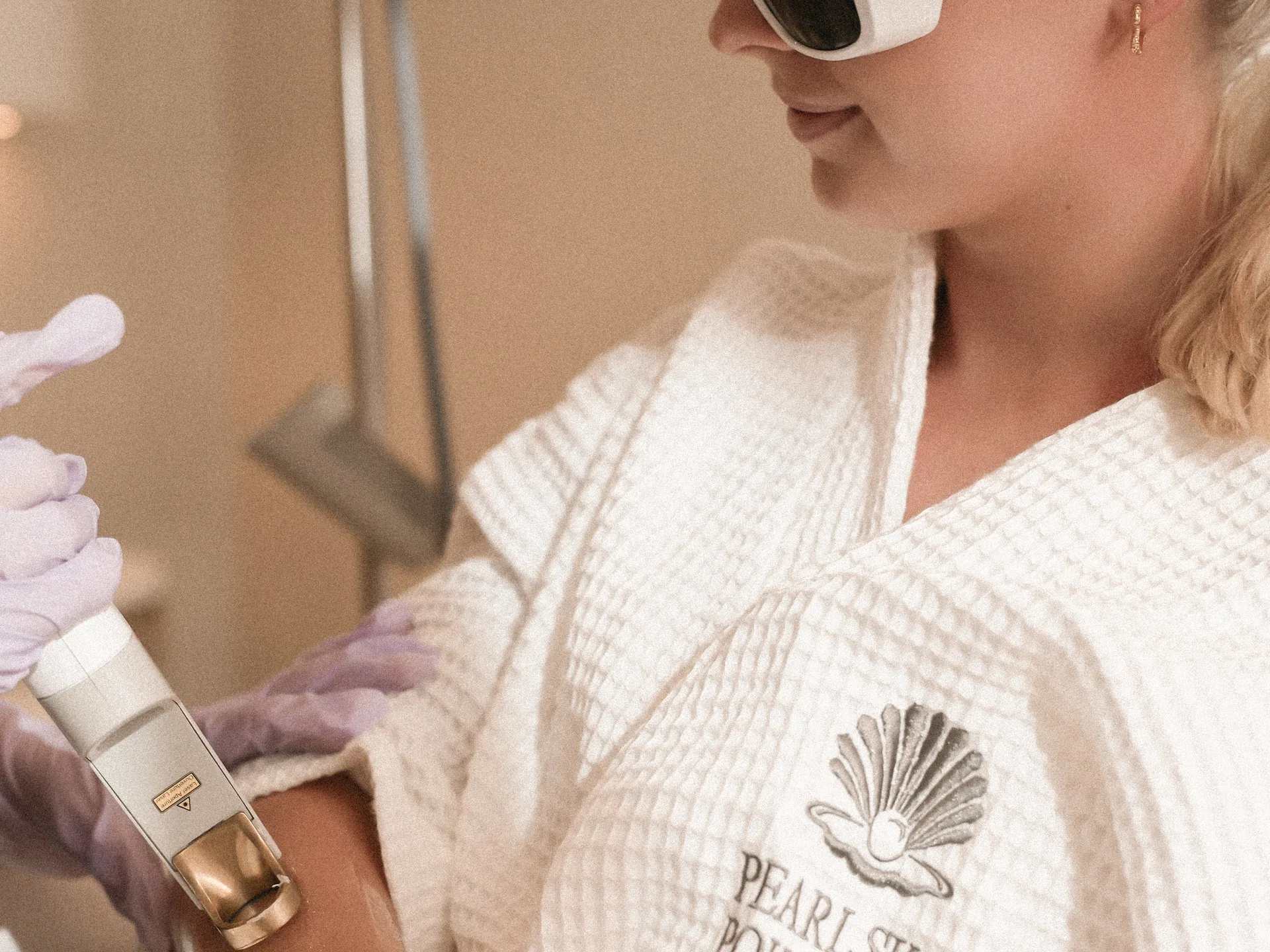 A patient having laser hair removal on the forearm with the Cutera handpiece